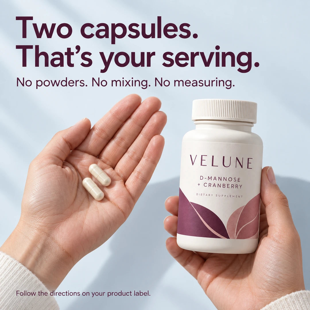 Two capsules. That's your serving. No powders. No mixing. No measuring. Follow the directions on your product label. Two capsules in a palm beside the VELUNE bottle.